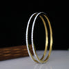 A sleek and sophisticated bangle adorned with sparkling lab-grown diamonds - perfect for elevating everyday elegance or special occasions