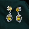 Elegant Marquise &amp; Round Lab-Grown Diamond Earrings Featuring Yellow Center Stone