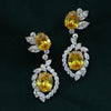 Elegant Marquise &amp; Round Lab-Grown Diamond Earrings Featuring Yellow Center Stone