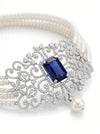 choker-style pearl and diamond necklace featuring a stunning deep blue gemstone centerpiece