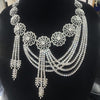 Elegant diamond necklace on a black mannequin bust